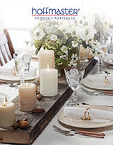 Hoffmaster Product Catalog cover showing disposable foodservice products including paper napkins, placemats, cutlery, and tabletop accessories arranged on a blue table.